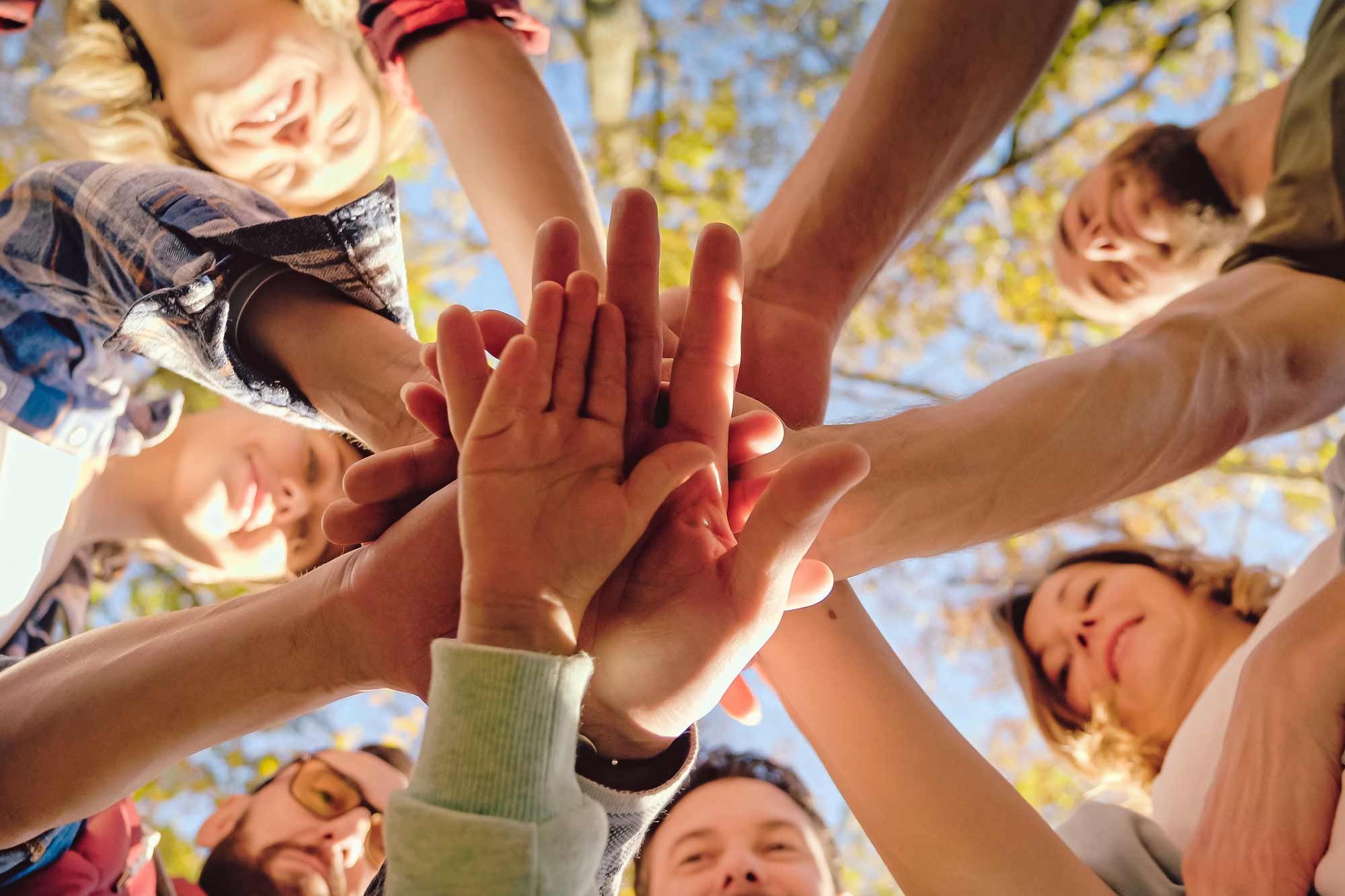 community-of-hands-together-stacked