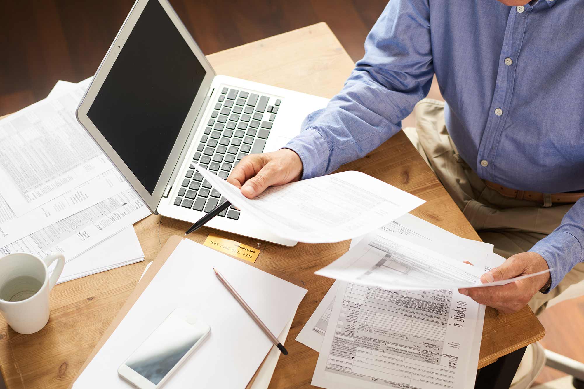 man reviewing paperwork